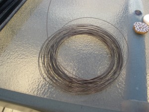 A roll of uncut 22 gauge wire in Antiqued Brass finish